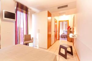 Postel nebo postele na pokoji v ubytování Agorà Hotel