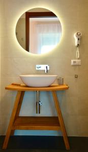 a bathroom with a sink and a mirror at Monterosso Rooms in Monterosso al Mare