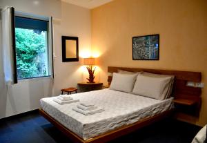 Postel nebo postele na pokoji v ubytování Monterosso Rooms