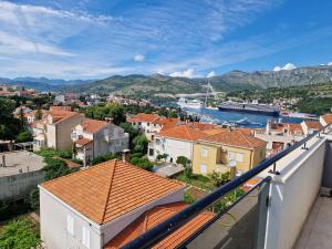 a view from the balcony of a town with houses at Apartments Mak & Lux in Dubrovnik