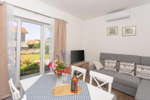 a living room with a couch and a table at Mara in Šibenik