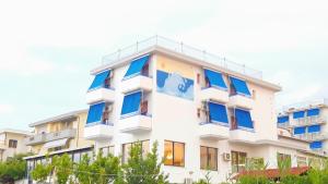 an image of a building with blue windows at Hotel Mare Blu -- boutique in Pineto