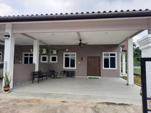 a large covered patio with a roof at Hostel KLIA in Sepang