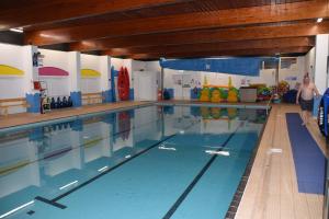 a large swimming pool with people in it at 32 Bayview Oceans Edge in Morecambe