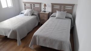 Postel nebo postele na pokoji v ubytování Casa Los García
