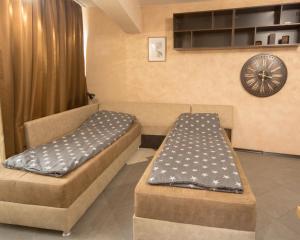 a room with two beds in a room at Aleks Holiday-center,sea,parking in Burgas City