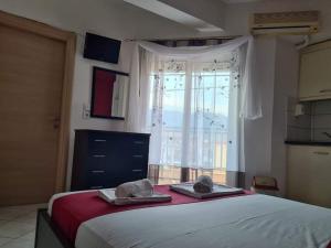 Postel nebo postele na pokoji v ubytování Katerina Studios