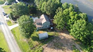 an aerial view of a house on the water at Riverbend Ranch for Family Fun on Smith Lake! Dogs welcome! in Crane Hill