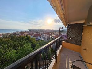 a balcony with a view of the ocean at Katerina Studios in Limenaria