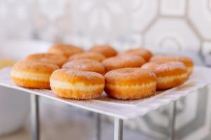 a bunch of donuts sitting on a white plate at Grand Muthu Forte Da Oura in Albufeira +49 photos