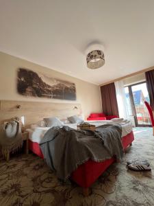 Posteľ alebo postele v izbe v ubytovaní Hotel Nosal Ski & Wine