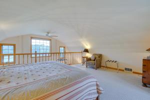 a bedroom with a large bed and a balcony at Vacation Rental Home in the Berkshires! in Williamstown