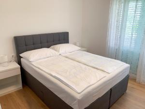 Postel nebo postele na pokoji v ubytování Haus Lupić