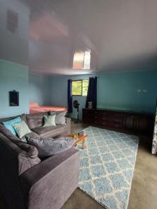 a living room with a couch and a table at House la Rosa third floor 5 in Quepos