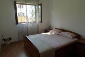 a bedroom with a bed and a window at House Meli in Rakalj