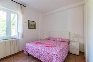 Postel nebo postele na pokoji v ubytování Le Castagne Apartments Ischia