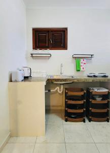 a kitchen with a sink and a counter top at One Bedroom Apartment Near the Beach in Jan Thiel