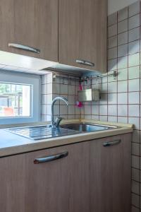 Kuchyň nebo kuchyňský kout v ubytování Le Castagne Apartments Ischia