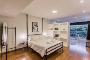 Cama ou camas em um quarto em Las Mimosas by Wynwood House
