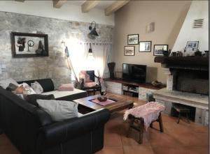 a living room with a couch and a fireplace at Luxury Casa Nini w fireplace and private pool in Poreč