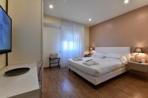 Postel nebo postele na pokoji v ubytování Hotel Residence Esplanade