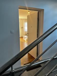 a view of a stair case with a mirror at Apartman Mila in Biograd na Moru