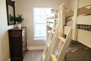 a room with a bunk bed and a staircase at ☆Live on the Water! Lake Palmetto Palm w/ Patio - 10Min to Downtown & Beaches☆ in Charleston +58 photos