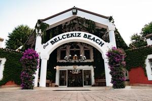 a building with a sign that reads not berkeley beach at Belcekiz Beach Club - All Inclusive in Oludeniz