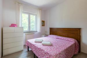 Postel nebo postele na pokoji v ubytování Le Castagne Apartments Ischia