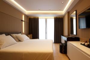 Postel nebo postele na pokoji v ubytování Caramel Boutique Hotel