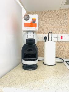 a coffee maker on a counter in a kitchen at Royal Sun NETFLIX Residence, Long Beach Design Apartment - no utility expenses! in Yeni Iskele