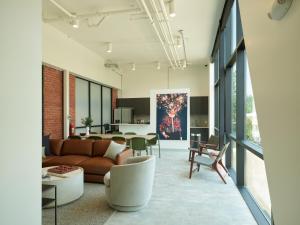 a living room with a couch and a table at Tomorrow Building at Somer Station in Chattanooga