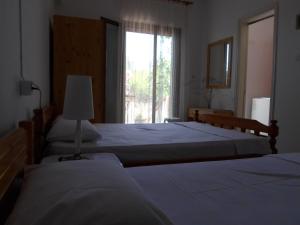 Postel nebo postele na pokoji v ubytování Bozelia Apartments