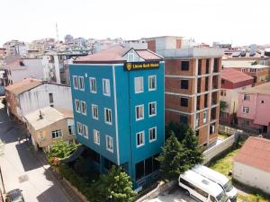 a blue building in the middle of a city at Lions Suit Hotel in Istanbul