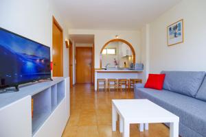 TV a/nebo společenská místnost v ubytování CORDOBA HomeStay by Turismar