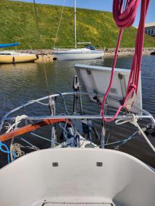 a boat is docked in a body of water at Valkirja in Klaipėda