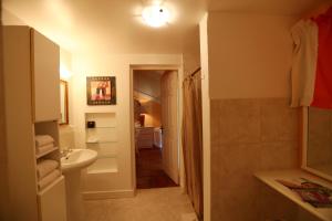 a bathroom with a sink and a toilet at The Legend Garden Condos in Saint Peter