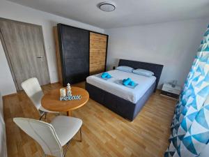 Cama ou camas em um quarto em Apartma RELAX