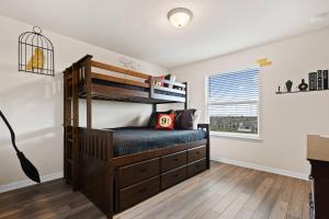 a bedroom with two bunk beds and a window at Luxury Six Bed Four in Bath Windsor Island BSV1707 in Davenport