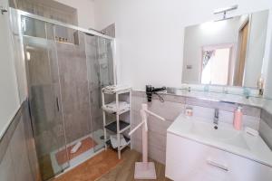 a bathroom with a shower and a sink at ROSE HOUSE in Siracusa +15 photos