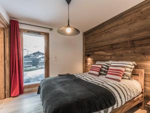 Posteľ alebo postele v izbe v ubytovaní Appartement duplex au centre de Chamonix avec WiFi et parking - FR-1-343-189