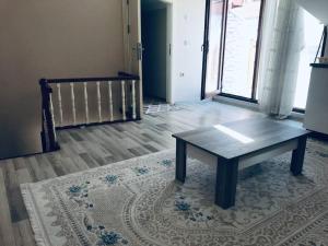 a coffee table sitting on a rug in a room at Relaxable Apartment in Eyüp sultan in Istanbul
