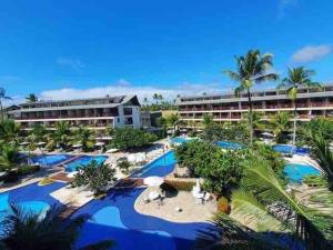 an aerial view of a resort with blue pools at Nannai Residence - Apartamento Duplex in Porto De Galinhas