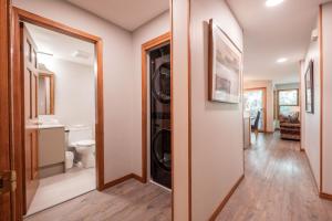 a laundry room with a washer and dryer at Arrowhead Point by Outpost Whistler in Whistler
