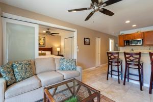a living room with a couch and a kitchen at 2 Bedroom Kapaa Condo, Pool, AC, Beach Access KK116 in Kapaa