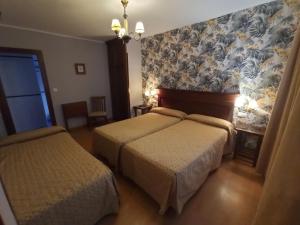 Postel nebo postele na pokoji v ubytování La Estrada