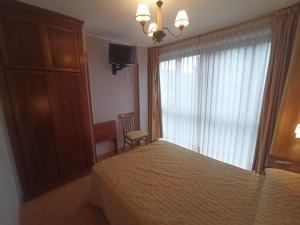 Postel nebo postele na pokoji v ubytování La Estrada