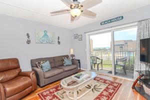 a living room with a couch and a table at Creston House 6E in St. Augustine