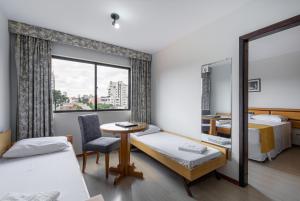 Postel nebo postele na pokoji v ubytování Hotel Flat Petras Residence