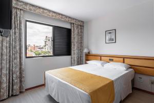 Postel nebo postele na pokoji v ubytování Hotel Flat Petras Residence
